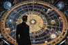 Cyberpunk figure observing a celestial map with zodiac constellations and clock-faced planets in an abstract surreal art print