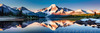 Snow-Capped Mountain Peaks Reflection at Dawn with Calm Lake Art Print